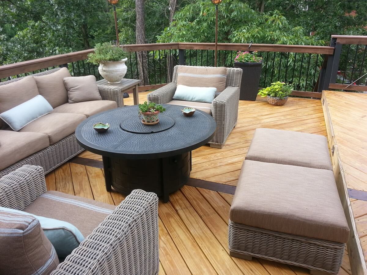 deck with couch and plants
